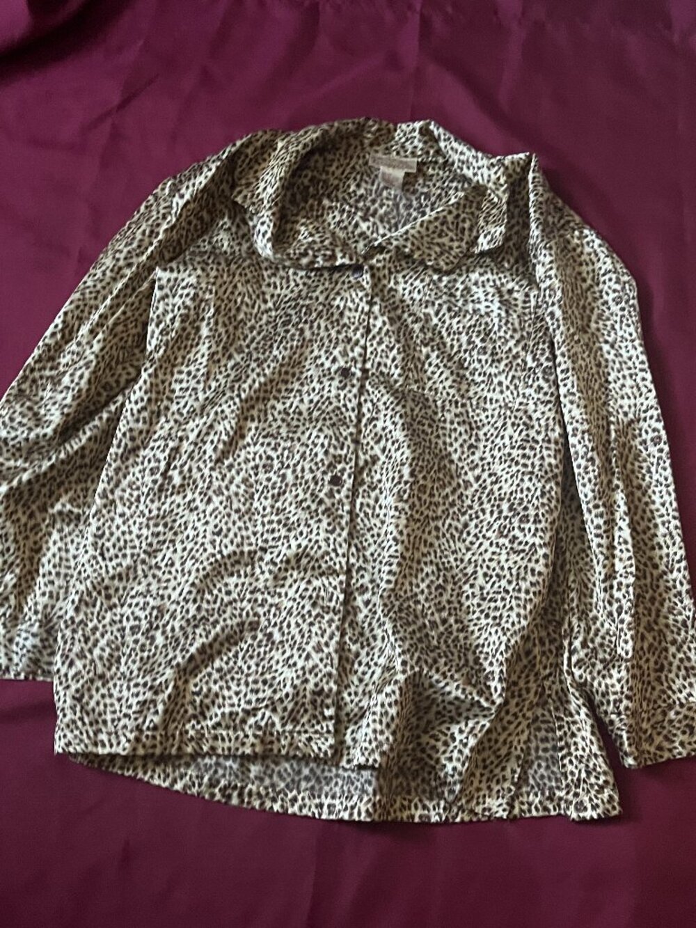 Long-sleeve button front leopard print shirt for woman size M.